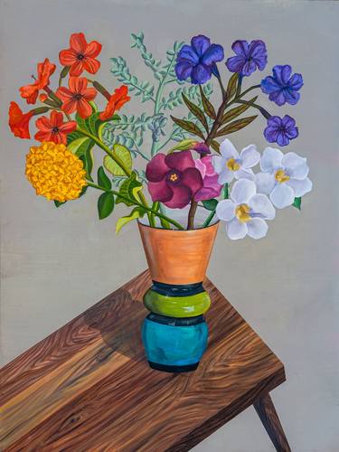 Flowers in vase on a wooden  table thumb