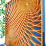 Perspective view of complete coloured wood wall sculpture.