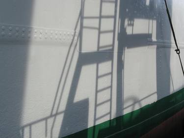 crane shadow on the ship's side thumb