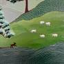 Sheep roam while a reader rests under a tree