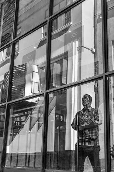 A mysterious man standing in front of a coffee shop in Lima downtown thumb