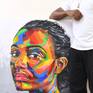 The artist standing with the artwork