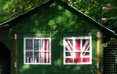 Union Jack and US flag in a shed's windows, artistic photo thumb