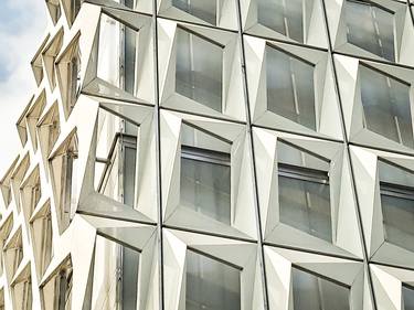 Geometric faceted grid architecture facade thumb