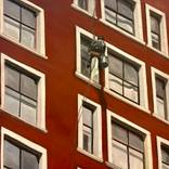 Window Washer(Blackstone Hotel) by greg morrissey