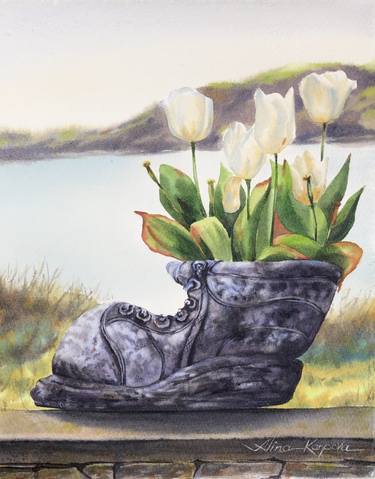 White tulips in old shoe planter sea view thumb