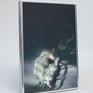 Sold with 2 1/8in deep silver metal frame