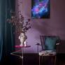 It is like a window that will take the viewer far beyond the room. Violet and pink shades give a glowing effect to the image of the night sky.