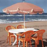 Plastic Chairs by the Ocean by Kevin Franitch