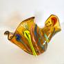 Organic Amber Glass Sculpture with “flowing” multicolored vitrigraph bulbs. Vitrigraph bulbs are the result of heating glass to a high temperature of 1600º and pulling it out of a kiln while moltent. 
This abstract design can be positioned many ways to suit the eye of the beholder!

Hand washing recommended