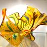 Organic Amber Glass Sculpture with “flowing” multicolored vitrigraph bulbs. Vitrigraph bulbs are the result of heating glass to a high temperature of 1600º and pulling it out of a kiln while moltent. 
This abstract design can be positioned many ways to suit the eye of the beholder!

Hand washing recommended