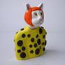 One of my Cat Gang series of anthropomorphic animal sculptures based on famous artists. This one is a cat character inspired by Japanese artist Yayoi Kusama. 

She's a little bit of fun to help brighten up your day.