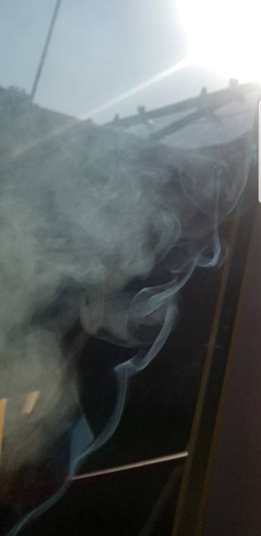 God with the many faces. Air element seen in sigaret smoke thumb