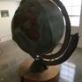 I made this globe in 1989. It rotates two different ways...but because of age it does not rotate very well anymore. It is made by stretching canvas over a plywood skeleton and the use of two bicycle axles. The globe is in two halves and they don't fit like they used to. The pictures show the globe being shown in my art show at Woodbury University in 2016. Please not: the size is approximate and World will need to be assembled.