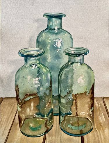Three turquoise bottles on the wooden table(173) thumb