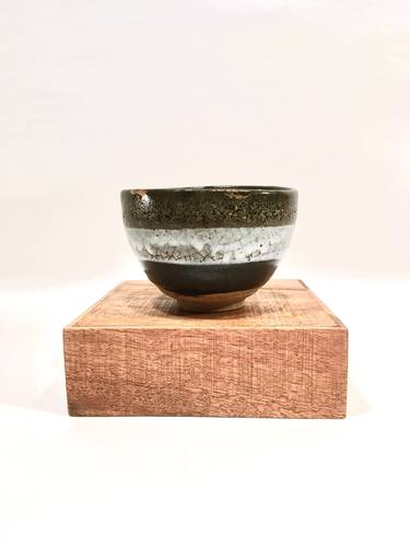 Tea bowl with iron and white glazes with gold markings thumb