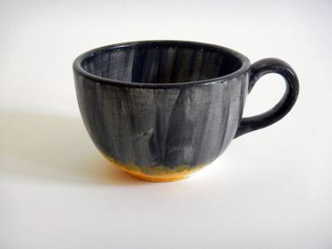 Yellow cup for tea thumb