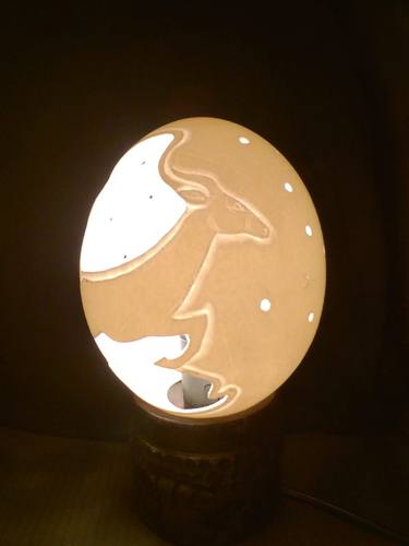 Antelope carved on an Ostrich Egg thumb