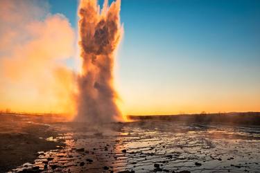 Eruption of the Geysir in Iceland during the sunrise thumb