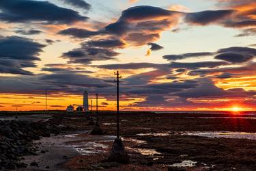 Seltjarnarnes lighthouse at sunset in low tide, Iceland thumb