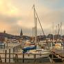 Collection Harbor with sailboats and yachts moored in the port.