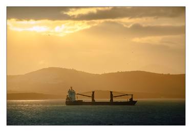 General cargo ship on sunset thumb