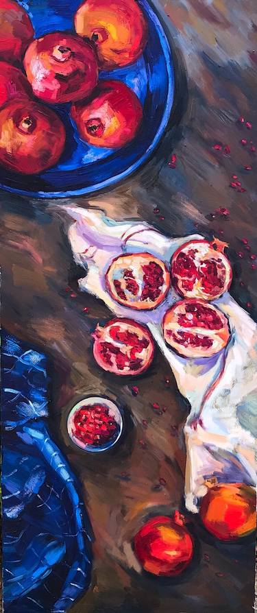 Red pomegranates with blue and white drape thumb