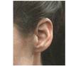 The newspaper photography as "model" to the painted image from a woman's ear.