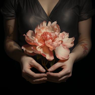 a woman holding a peony in her hand thumb