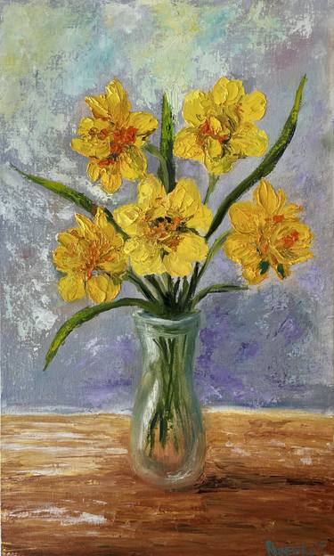 Bouquet of yellow daffodils in a transparent vase thumb