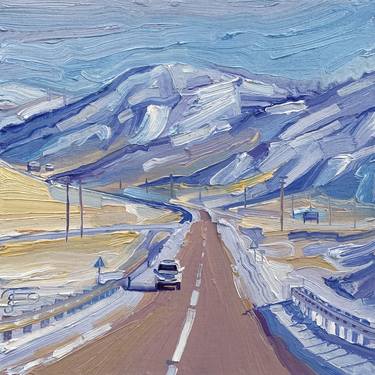 Road in a snowy hills thumb