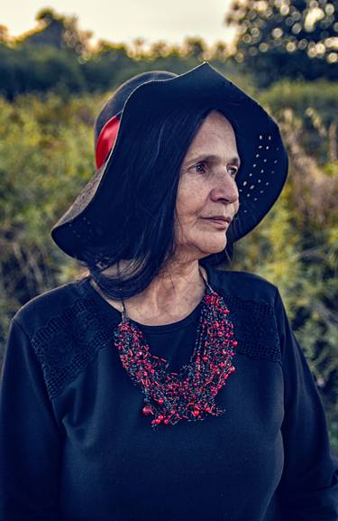 An old woman, a grandmother with long hair in a black dress, hat and beads - Limited Edition of 3 thumb