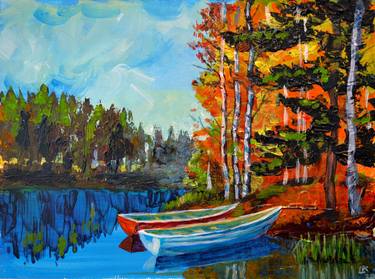 Boats on a lake. Autumn landscape. thumb