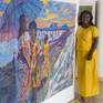 Artist standing beside piece for scale