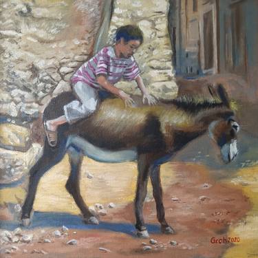 Boy riding donkey thumb