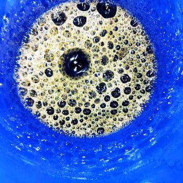 Air bubbles for breakfast, inside a blue plastic cup. thumb