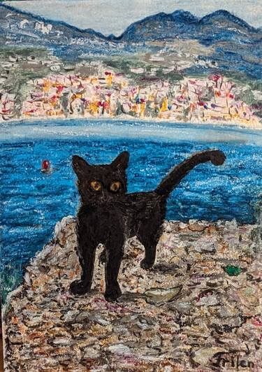 A black cat with yellow eyes and the blue sea thumb