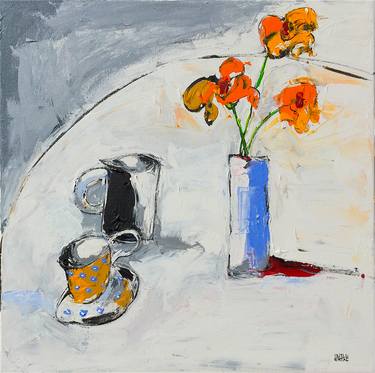 Yellow Flowers in Blue Vase and Cup on Table thumb