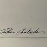 The signature on the back side.