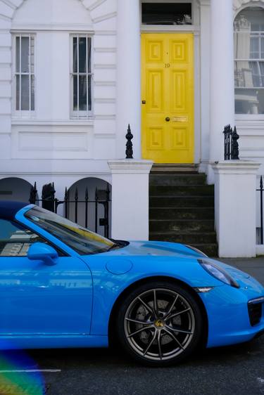 blue car and yellow door thumb