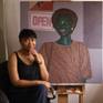 Artist and art in studio.