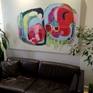 "Negotiations" hanging on the wall, above a couch (photo 1).