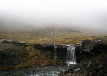 Icelandic landscapes. Foggy Skutafoss waterfall thumb