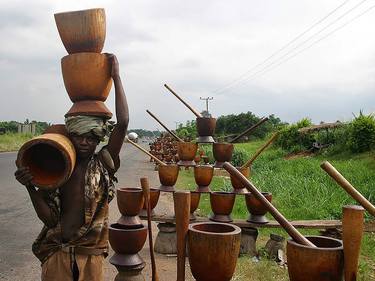 mortal and pestle on display for sale to pound (pounded) yam thumb