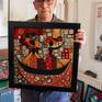 The work is framed
