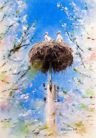 Blooming garden and storks in the nest. thumb