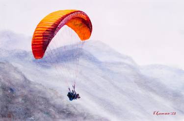 A paraglider in tandem soars over the mountains in a foggy haze. thumb