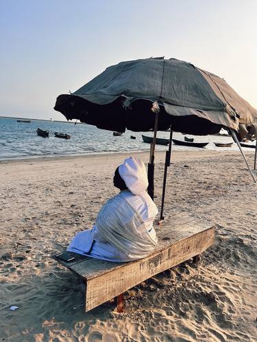 A woman stares at the sea thumb