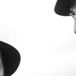 Two Men Talking at the Race Track by Mark Bigelow