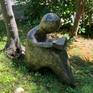 Seated under a tree